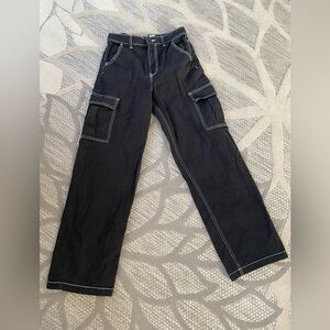 Young woman black Jean pants with white trim